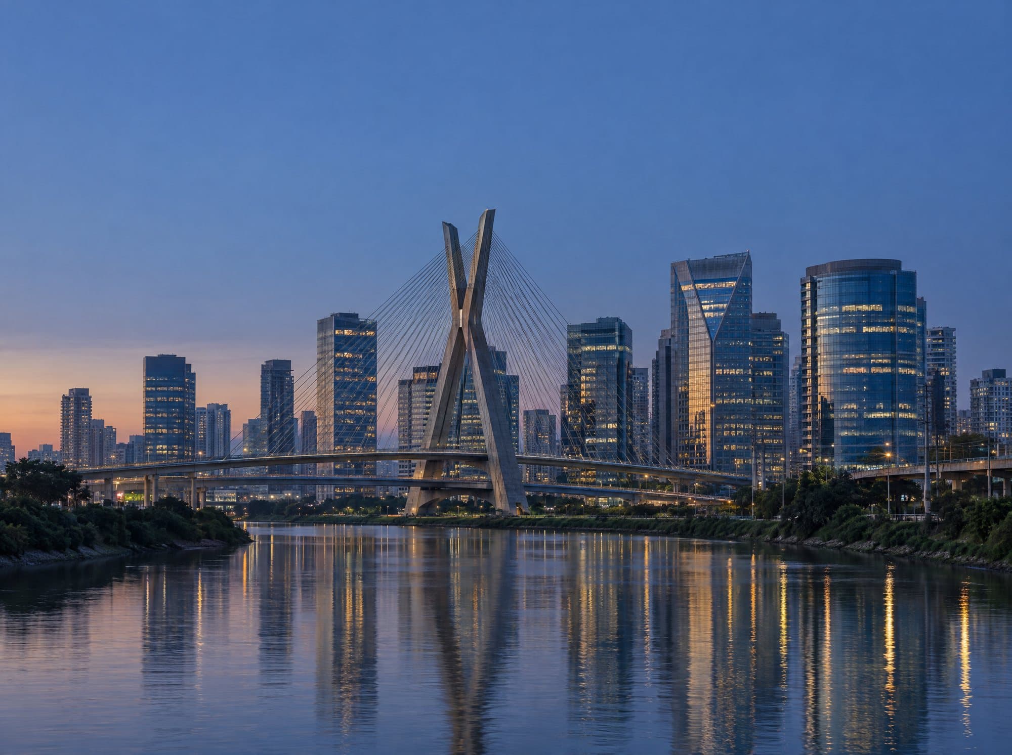 São Paulo’s business district at dusk, with the Octávio Frias de Oliveira cable-stayed bridge over the Pinheiros River.